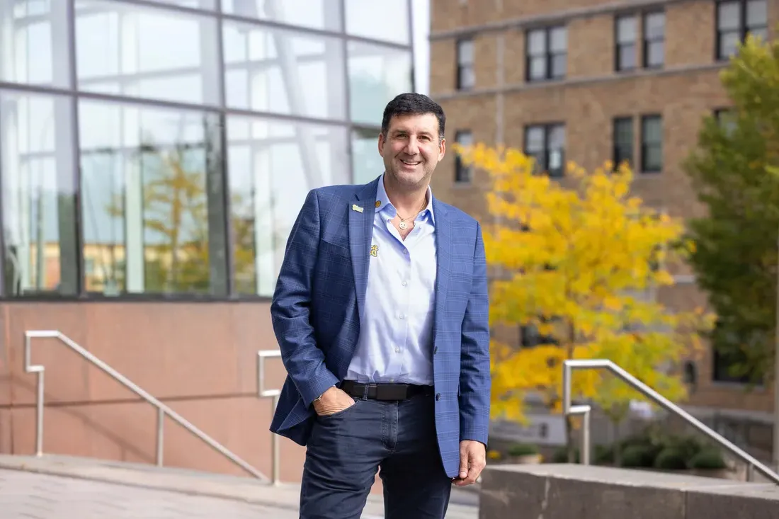 Aaron Krause outside a Syracuse University building.